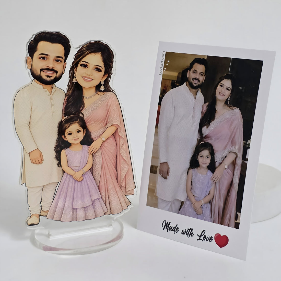 Chibi family of 3 standee next to the customer's original family photo
